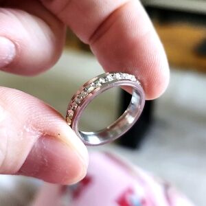 3 beautiful rings, 2 silver with crystals size 6, 1 rose gold size 8